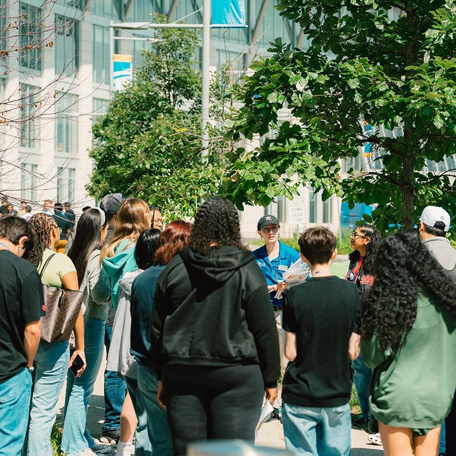 students outside with orientation guide at UMass Boston orientation 2023