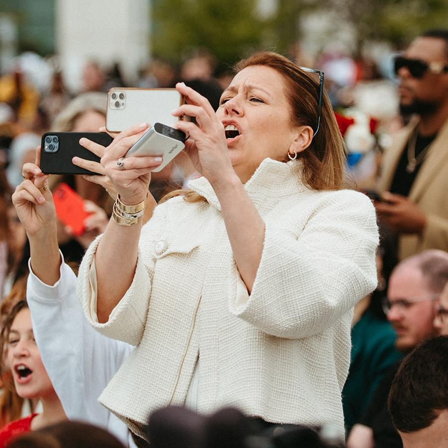 mother taking photo during commencement